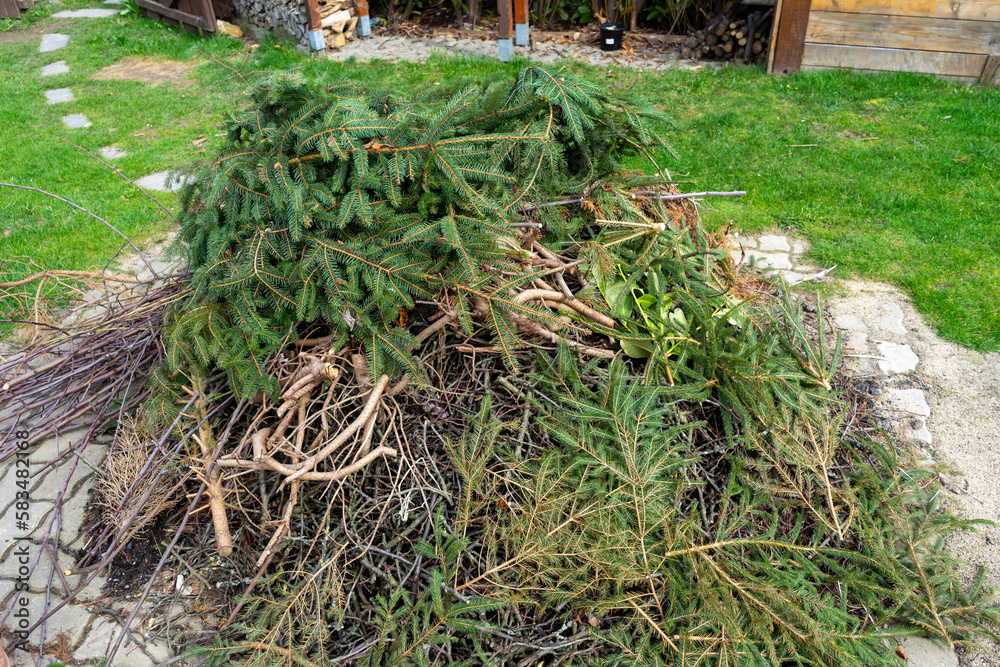 Obraz premium Heaps of garden waste for burning in the garden