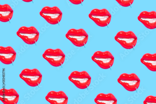 Seamless pattern made of sensual red lips with piercing ring on blue background.