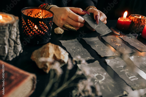 The woman is holding a smoking dry wood in her hands. Halloween