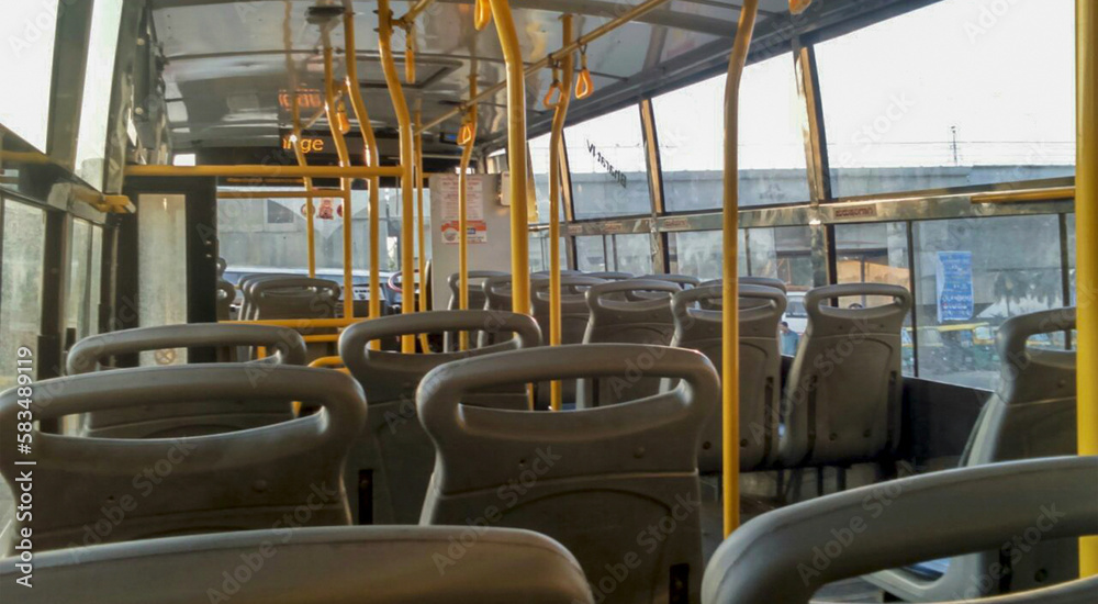 The interior of the local bus in Bangalore, empty. Passenger transportation. Public transport.