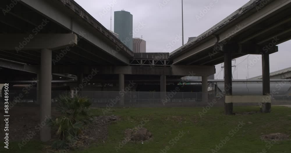 Low angle view of downtown Houston, Texas skyline from under bridge area Low angle view of downtown Houston, Texas skyline from under bridge area