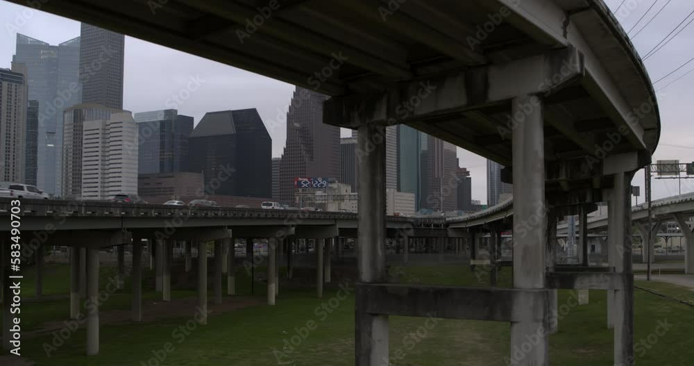 Low angle view of downtown Houston, Texas skyline from under bridge area Low angle view of downtown Houston, Texas skyline from under bridge area