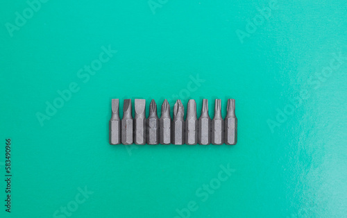 Set of heads for screwdriver  bits  Tools collection copy space  close up  selective focus. blurred dark background