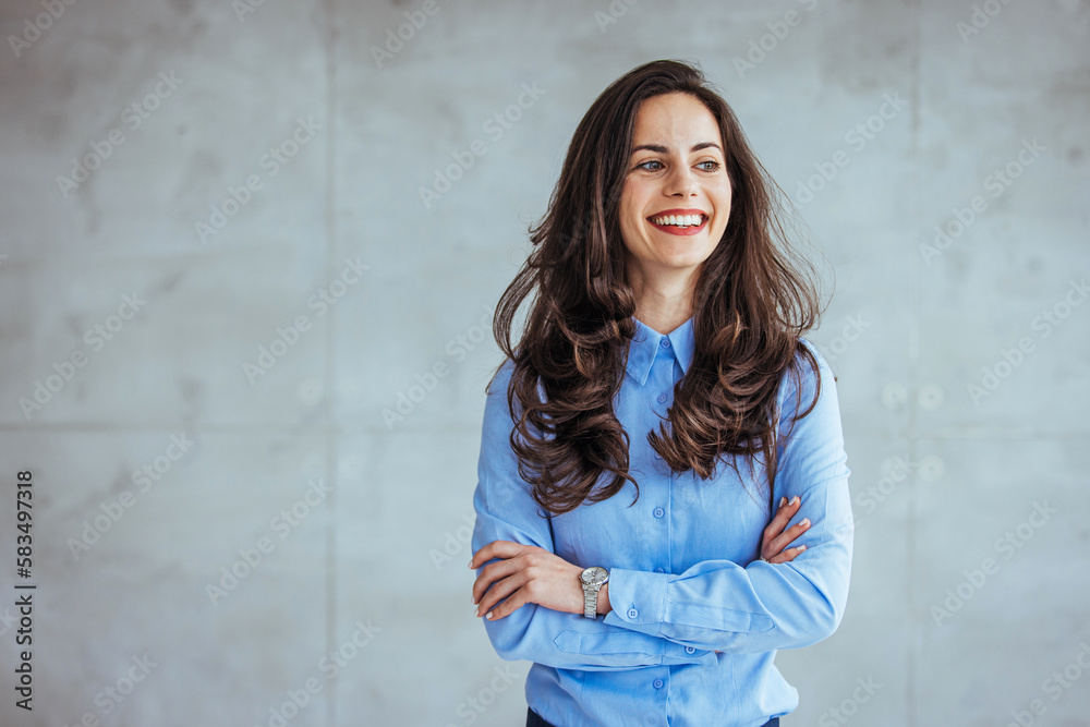 One Happy Pretty Business Woman Standing in Hall and looking at camera with smile. Studio headshot on white background. Spanish model. Portrait of a confident young businesswoman working One Happy Pretty Business Woman Standing in Hall and looking at camera with smile. Studio headshot on white background. Spanish model. Portrait of a confident young businesswoman working
