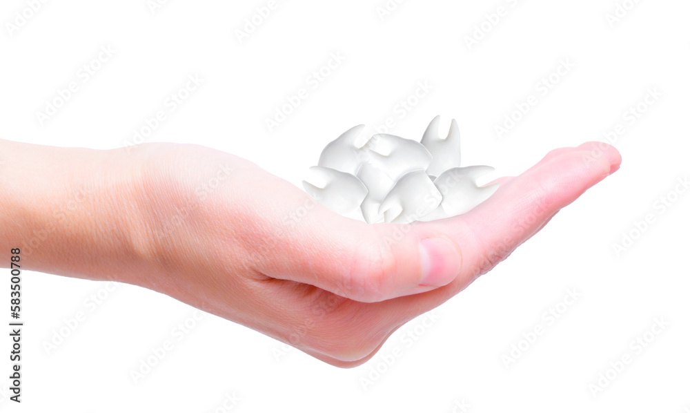 Close-up of a Hand Holding Teeth on White Background Close-up of a Hand Holding Teeth on White Background