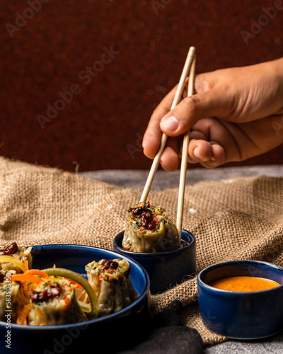 dimsum being picked up by chopstick