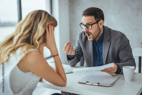 Boss threatening with finger his employee in office. Angry mean boss yelling at employee for missing deadline, executive manager scolding ineffective salesman showing bad work results