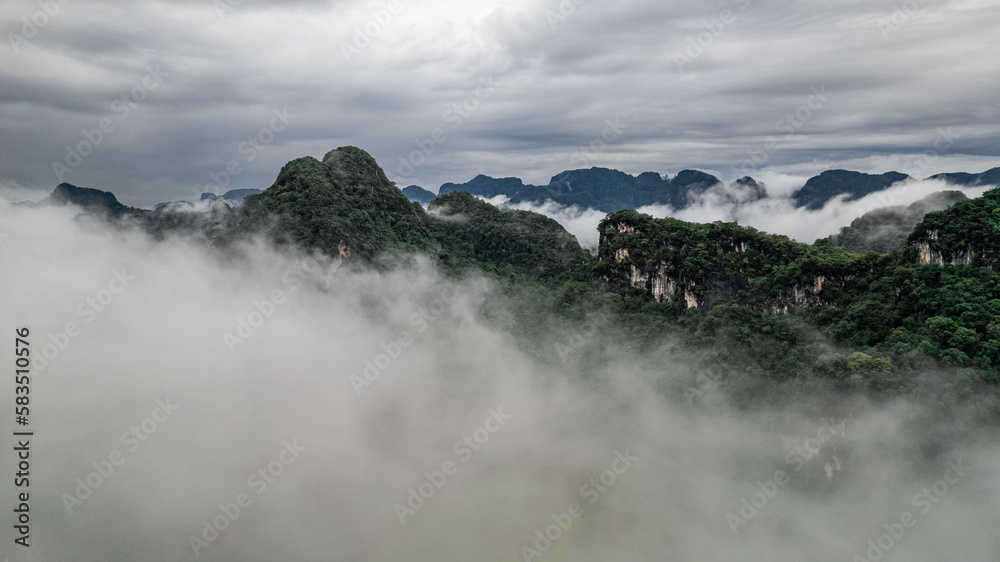 Aerial View of limestone mountain morning mist surrounding Phang Na City in Krabi Province Thailand