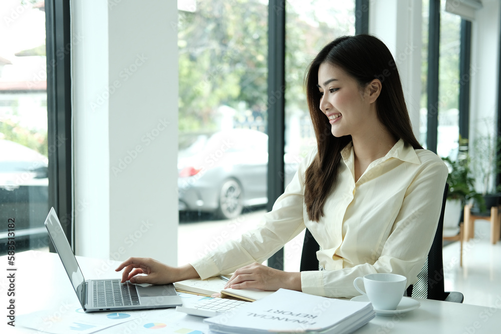 Beautiful young Asia woman working in office Beautiful young Asia woman working in office