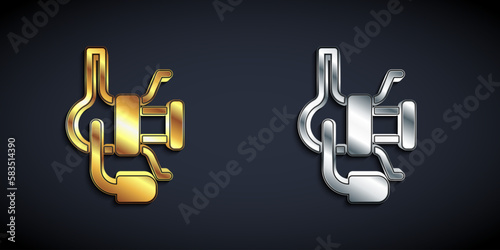 Gold and silver Spinning reel for fishing icon isolated on black background. Fishing coil. Fishing tackle. Long shadow style. Vector
