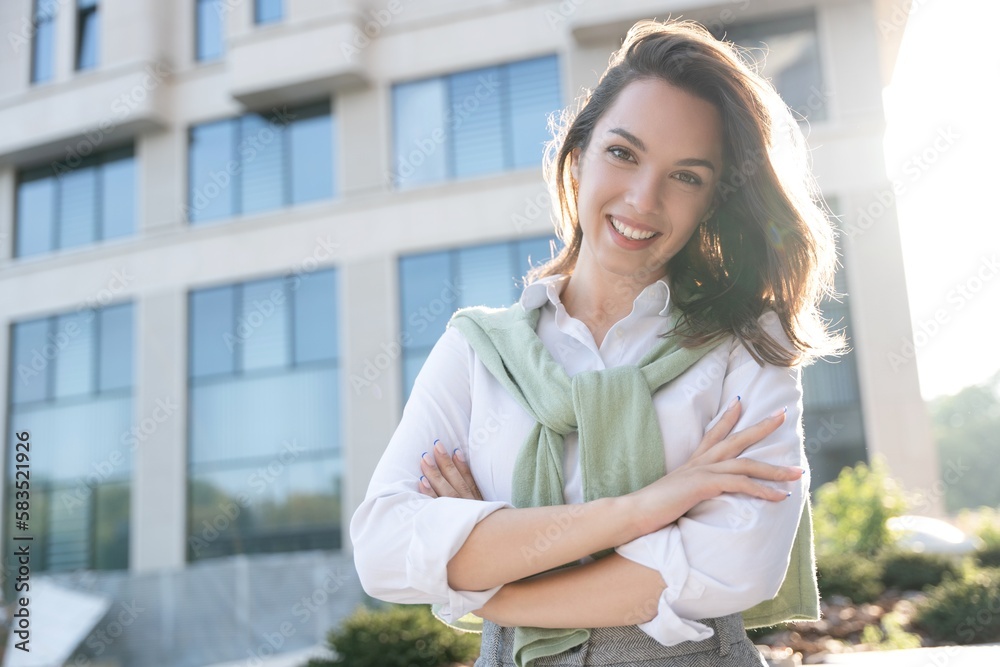 Businesswoman portrait. Caucasian female business person standing outdoor looking at camera