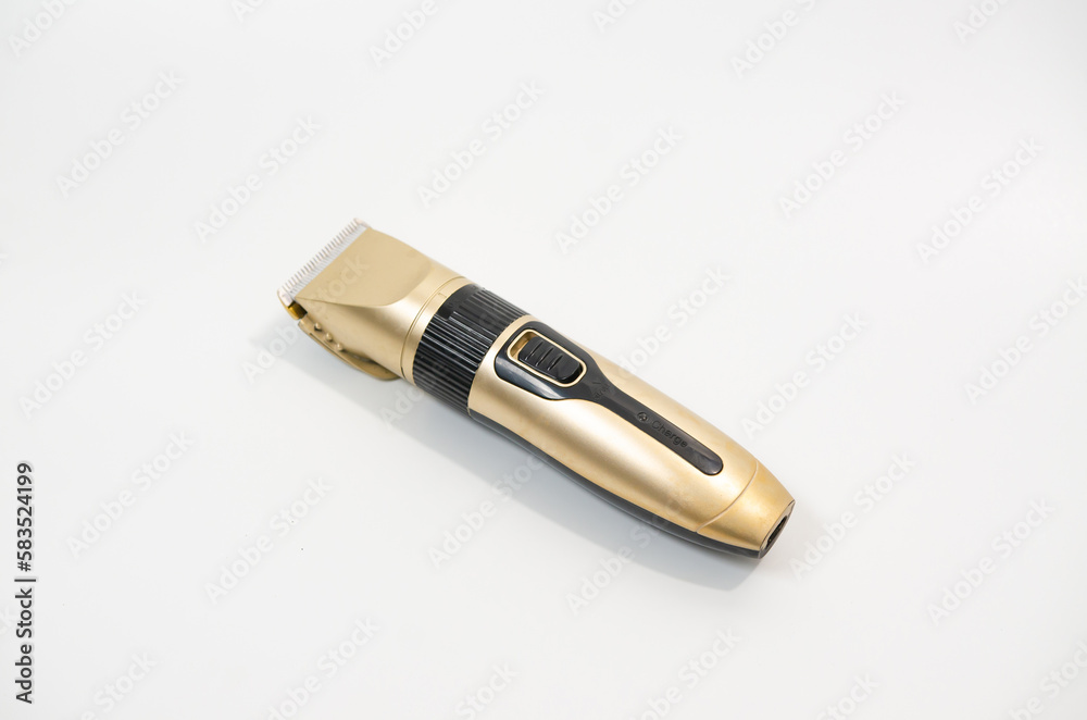 Electric pet clipper with plastic nozzle on a white background. Grooming tools for the hygienic care of pets cats and dogs. Selective focus Electric pet clipper with plastic nozzle on a white background. Grooming tools for the hygienic care of pets cats and dogs. Selective focus