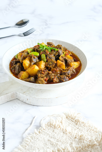 sambel goreng ati ampela is Indonesian food made from spices, chili, gizzard and liver chicken, potatoes and petai
