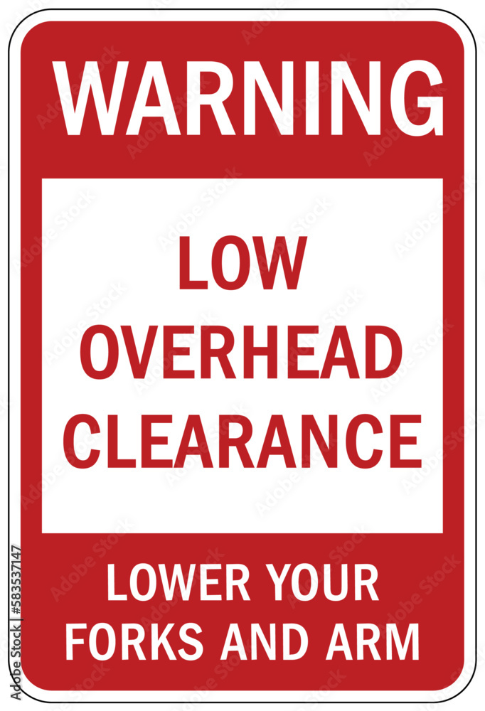 Fototapeta premium Low overhead clearance warning sign and labels lower your forks and arm