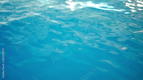 Wallpaper Mural Close-up blue water in sunbeam indoors. Swimming pool with no people in sunshine Torontodigital.ca