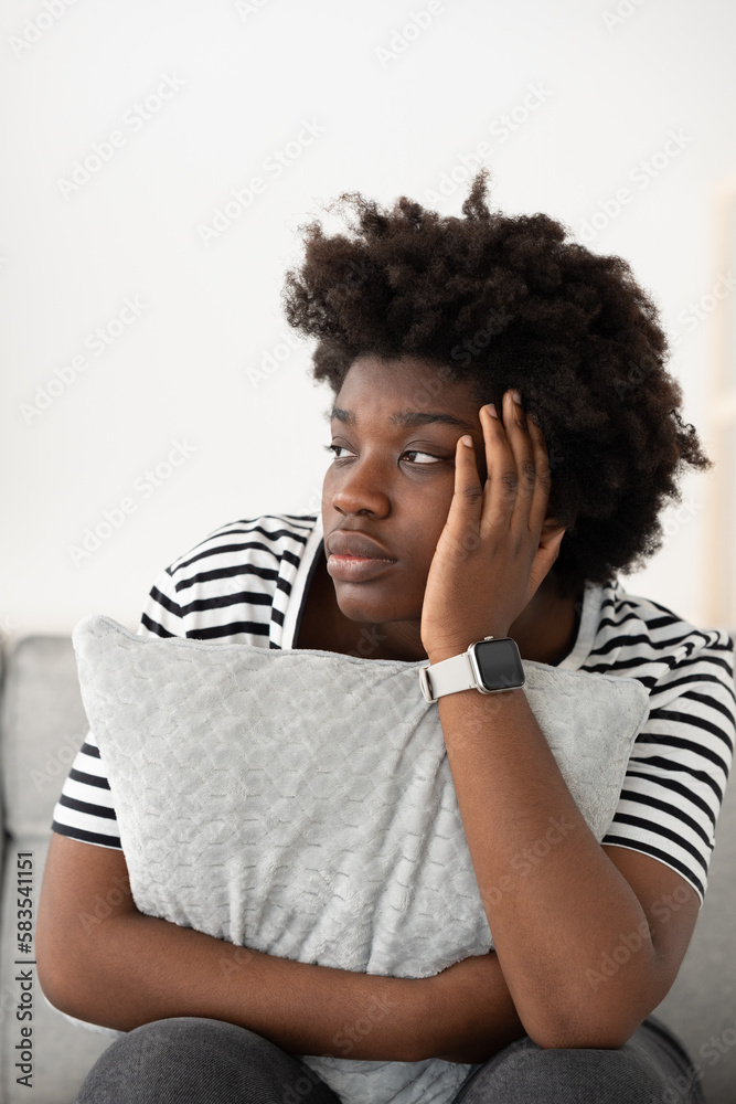 Young sad black woman hand on head suffering depression. Mental health concept Young sad black woman hand on head suffering depression. Mental health concept