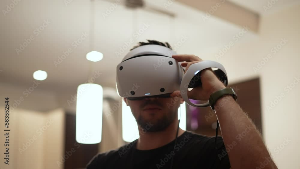 guy playing a game in virtual reality glasses guy playing a game in virtual reality glasses