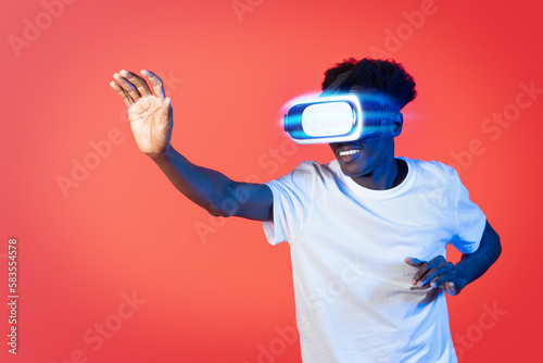 Smiling african american man wearing high tech smart vr goggles