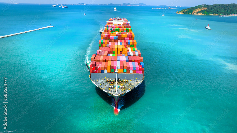 Aerial in front view of cargo ship carrying container and running for export goods from cargo yard port to custom ocean concept technology transportation , customs clearance. - obrazy, fototapety, plakaty 