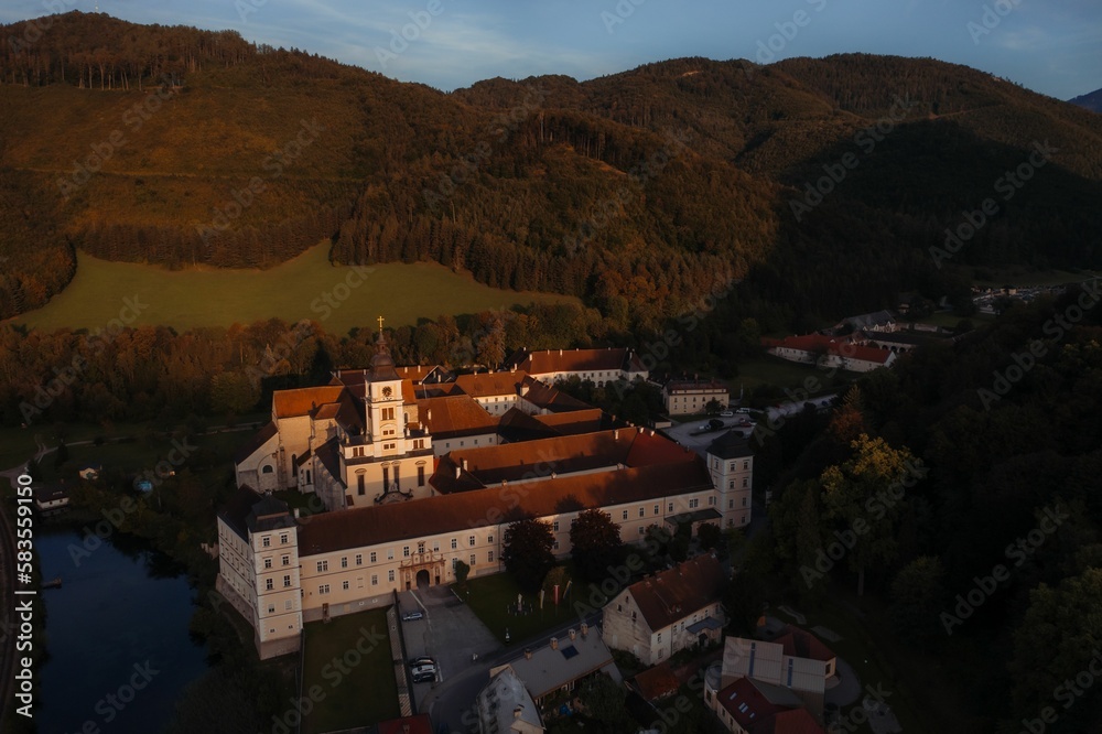 Drone shot of a monastery in the town of Lilienfeld during golden hour in Austria