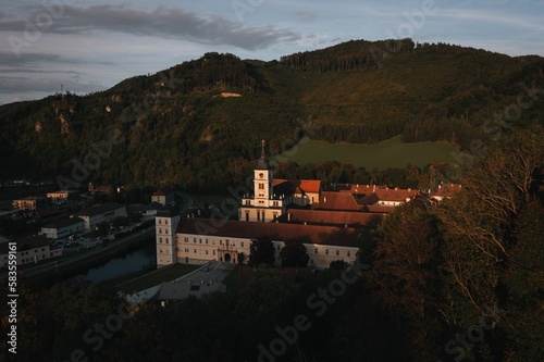 Drone shot of a monastery in the town of Lilienfeld during golden hour in Austria photo