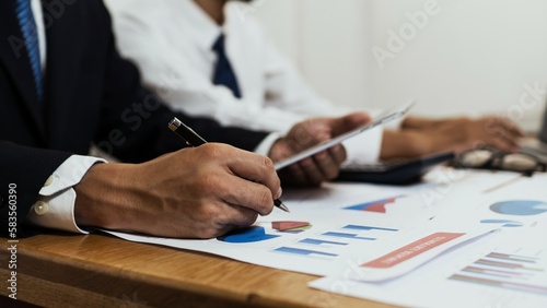 a businessman creating a financial business chart while working in an office