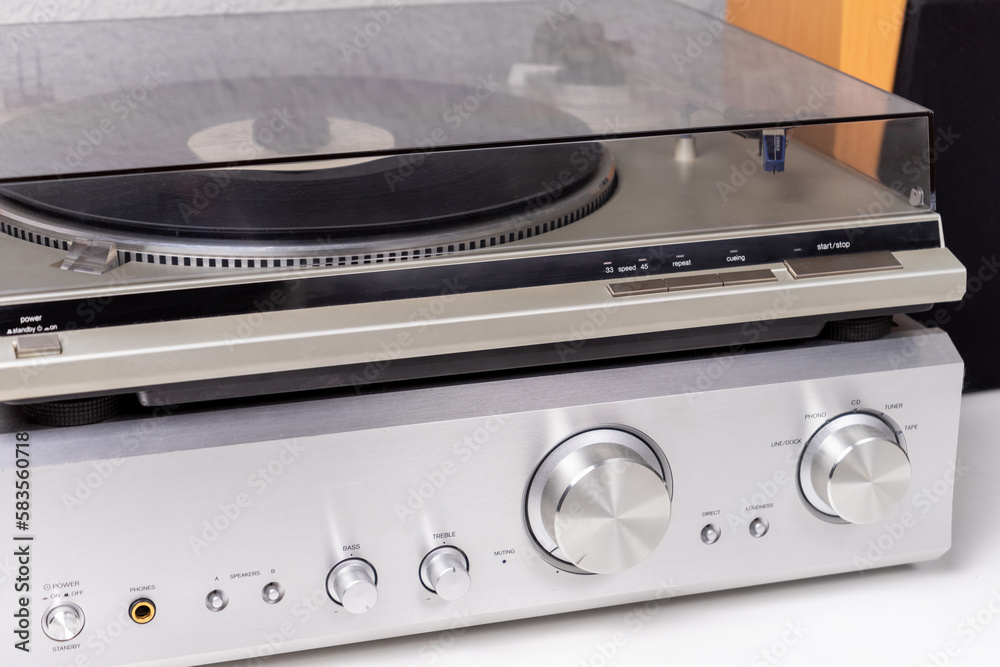 Fototapeta premium cropped view of vintage vinyl player and amplifier