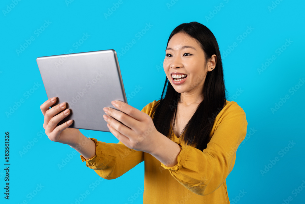 Emotional asian woman have video call, using digital tablet Emotional asian woman have video call, using digital tablet