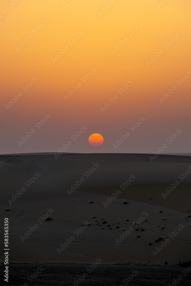 Sunset in Qatar desert.
