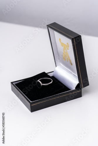 Silver ring and a black jewelry box © Dmytro