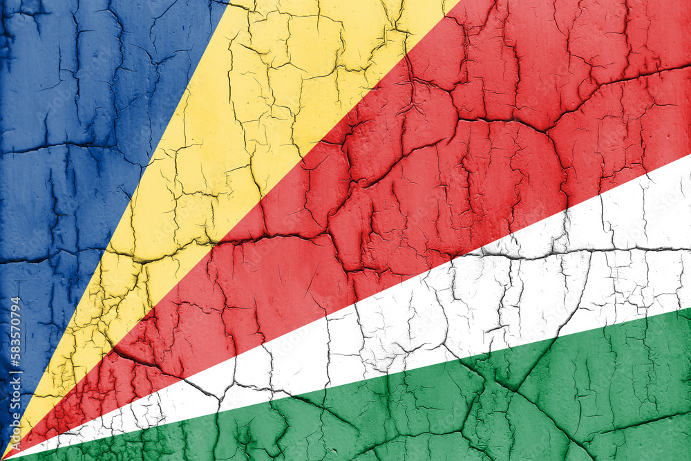 Flag of Seychelles on cracked wall, textured background.