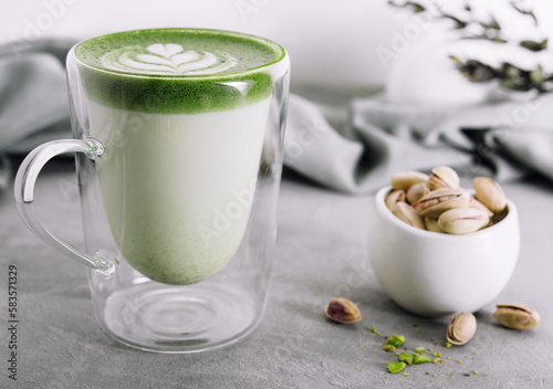 Green matcha latte with pistachios