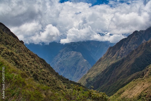 Aerial view of mountain peaks in Inca Trail, Peru, covered with green plants