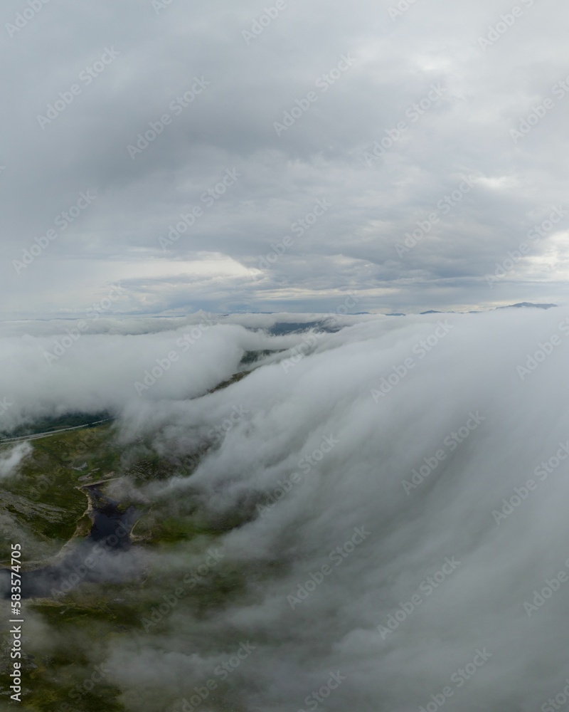 Vertical view of mountains with clouds