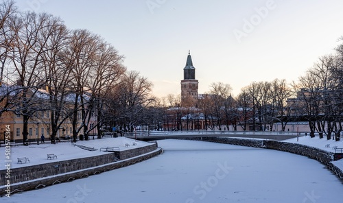Chilling view of a frozen river in the town of Turku in Finland during winter
