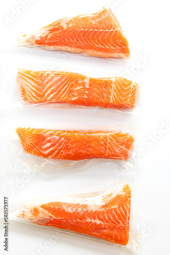 Fresh salmon fillet in vacuum package isolated on white background for delicious salmon steak. 