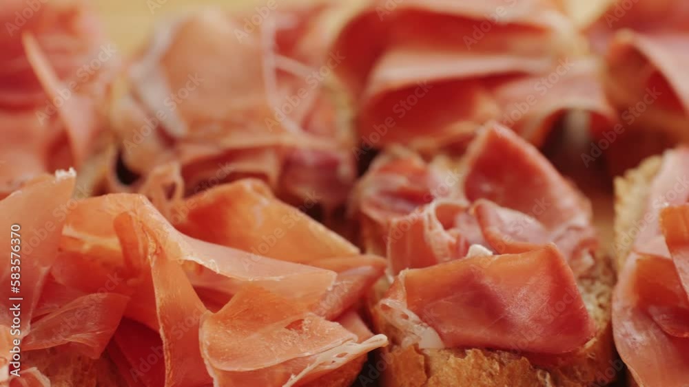 Jamon iberico tapas close up, chef cooking the best spanish ham pork tapas, cafe with traditional food. Jamon iberico tapas close up, chef cooking the best spanish ham pork tapas, cafe with traditional food.