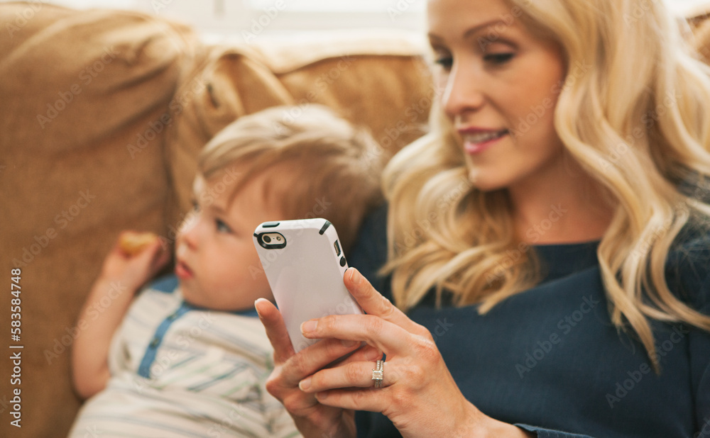 Mother Checking Text Messages While Child Watches Television Mother Checking Text Messages While Child Watches Television