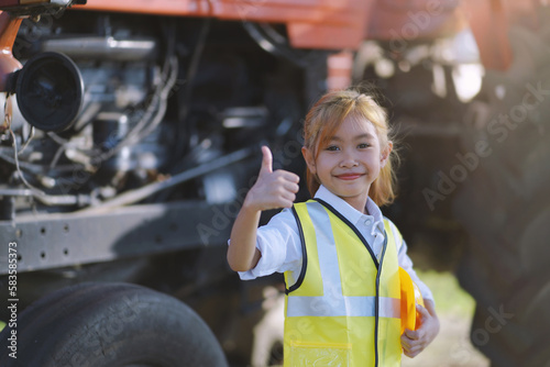 A girl wearing an engineer's uniform.future education technology of children.