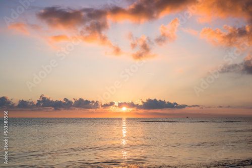 Sunset on the beach with clouds © robertdering