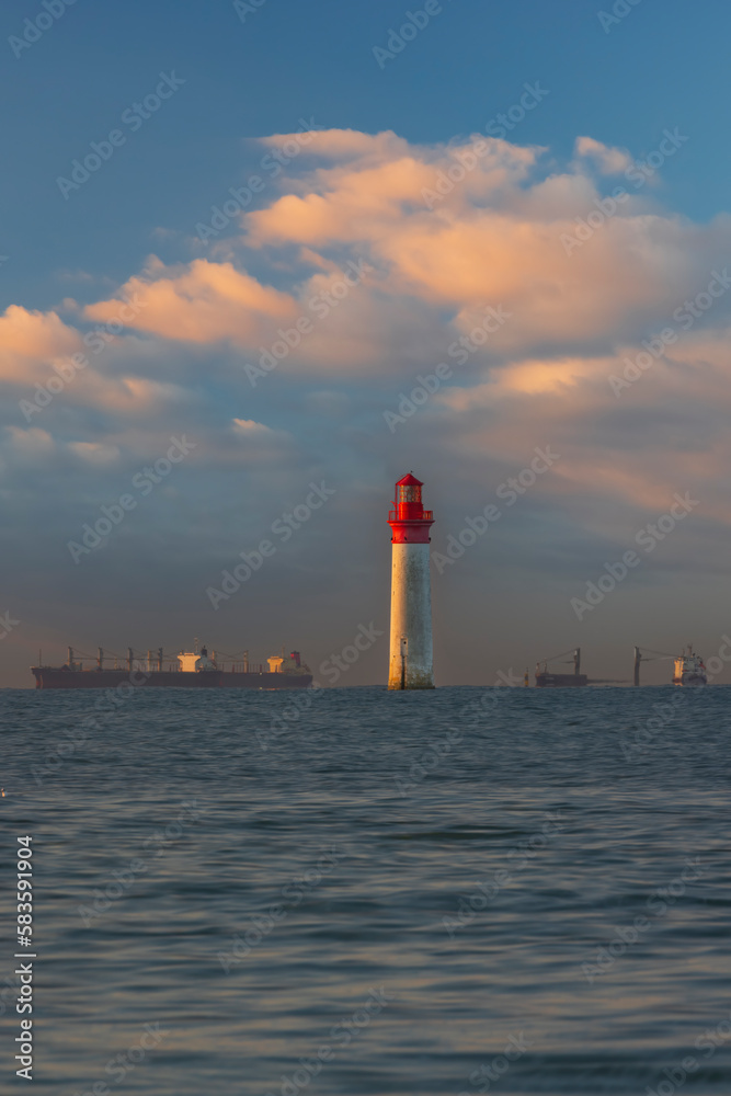Fototapeta premium Phare de Chauvea near Ile de Re with ships to La Rochelle, Pays de la Loire, France