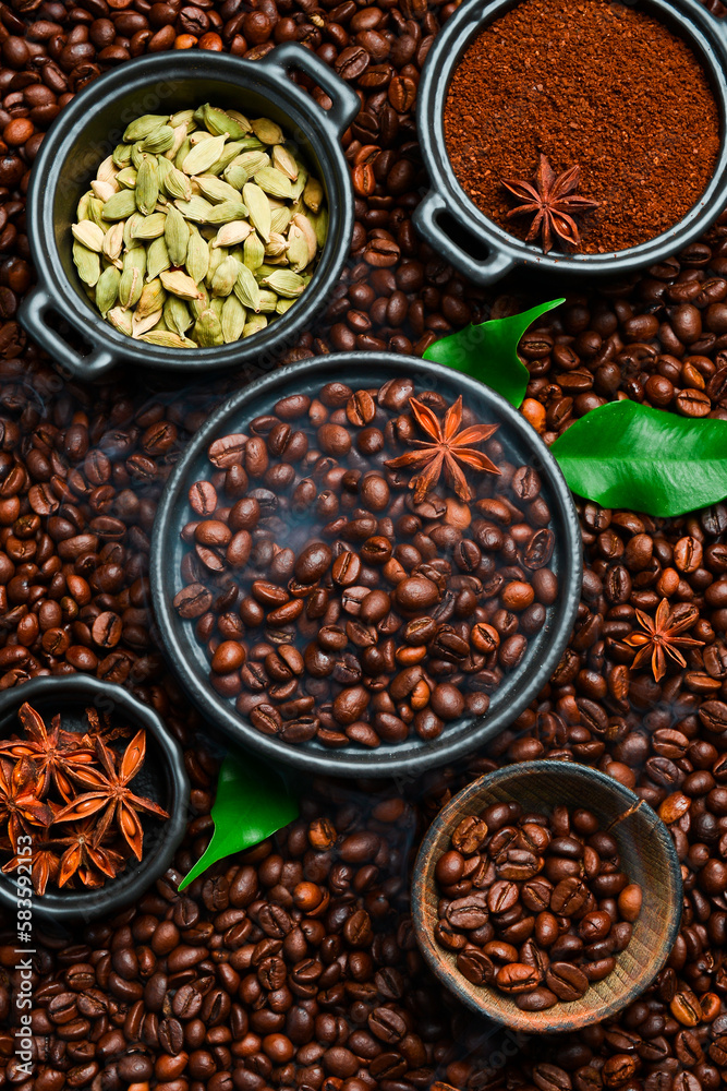 Roasted coffee beans with cardamom and anise. Arabica or robusta coffee. Coffee background.