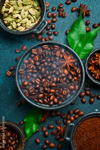 Preparation of aromatic coffee with cardamom and anise. Arabica or robusta coffee. Coffee background.