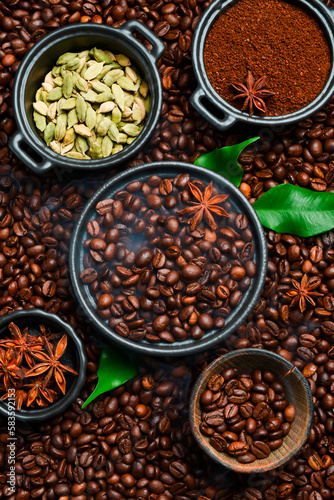 Roasted coffee beans with cardamom and anise. Arabica or robusta coffee. Coffee background.