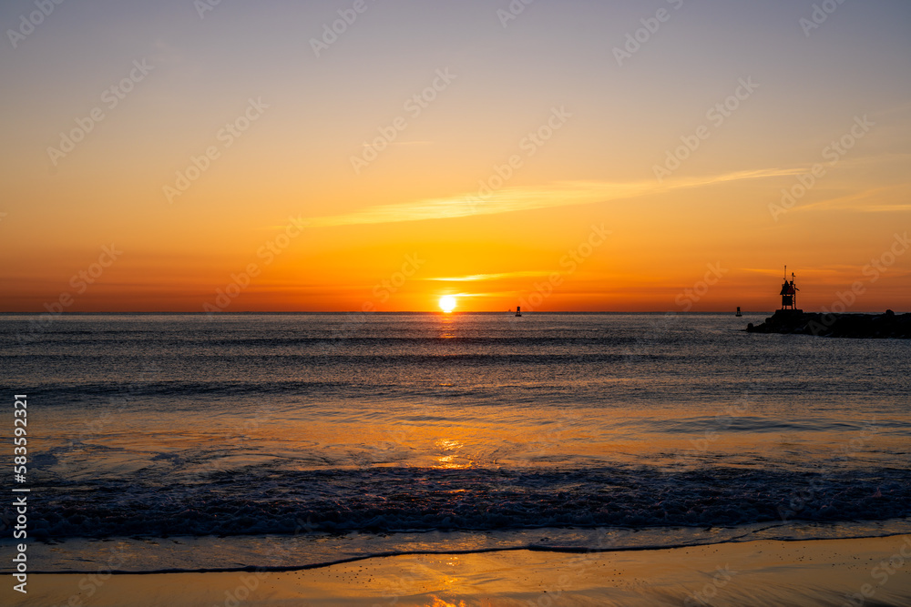 Morning Sunrise With the Virginia Beach 1st Street Jetty Shown at the Oceanfront