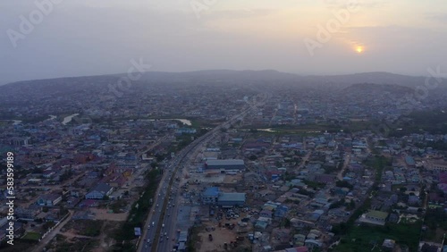 Wallpaper Mural Sunset on a community on hill in Accra with traffic Torontodigital.ca