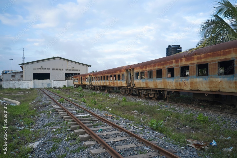 Old rusty train on a train track in Ghana