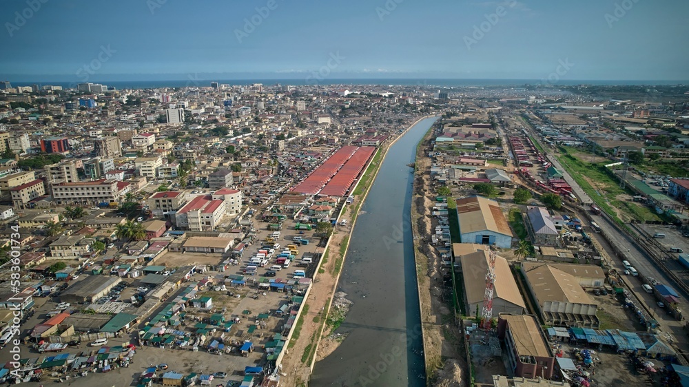 Bird's eye view of a water canal flows between residential districts