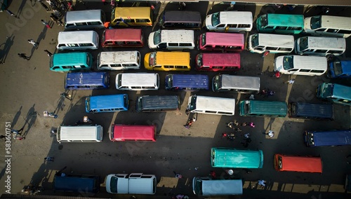 Aerial shot of colorful buses at lorry station in Accra