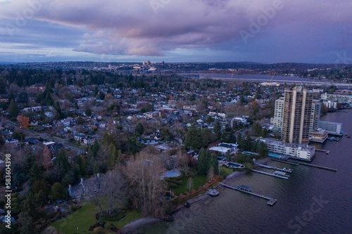 Cityscape of Seattle surrounded by the sea in the evening